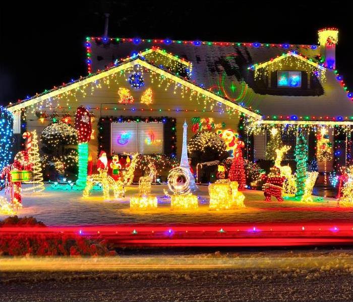 A house covered with Christmas lights of various colors.