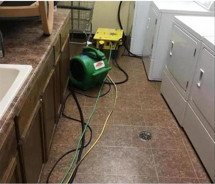 Flooded laundry room suffered storm damage 