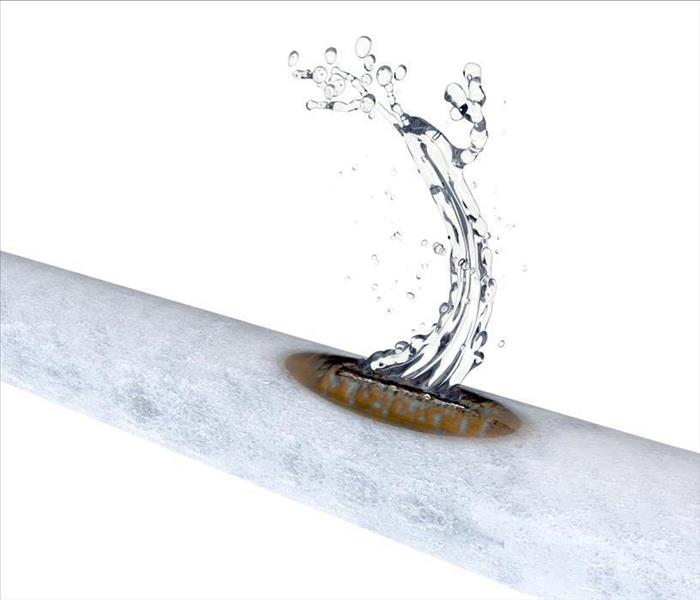 Image of frozen pipe leaking water.